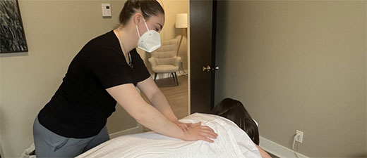 Registered Massage Therapist working on a client