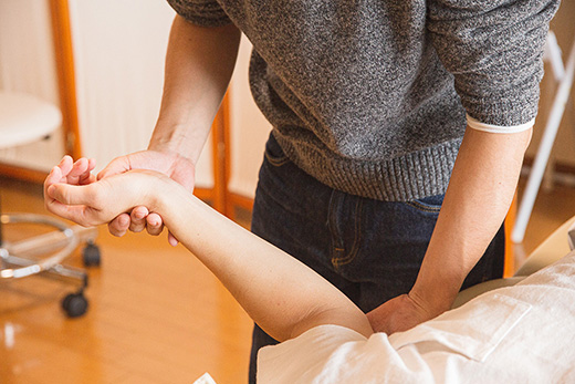 Therapist administering physiotherapy treatment
